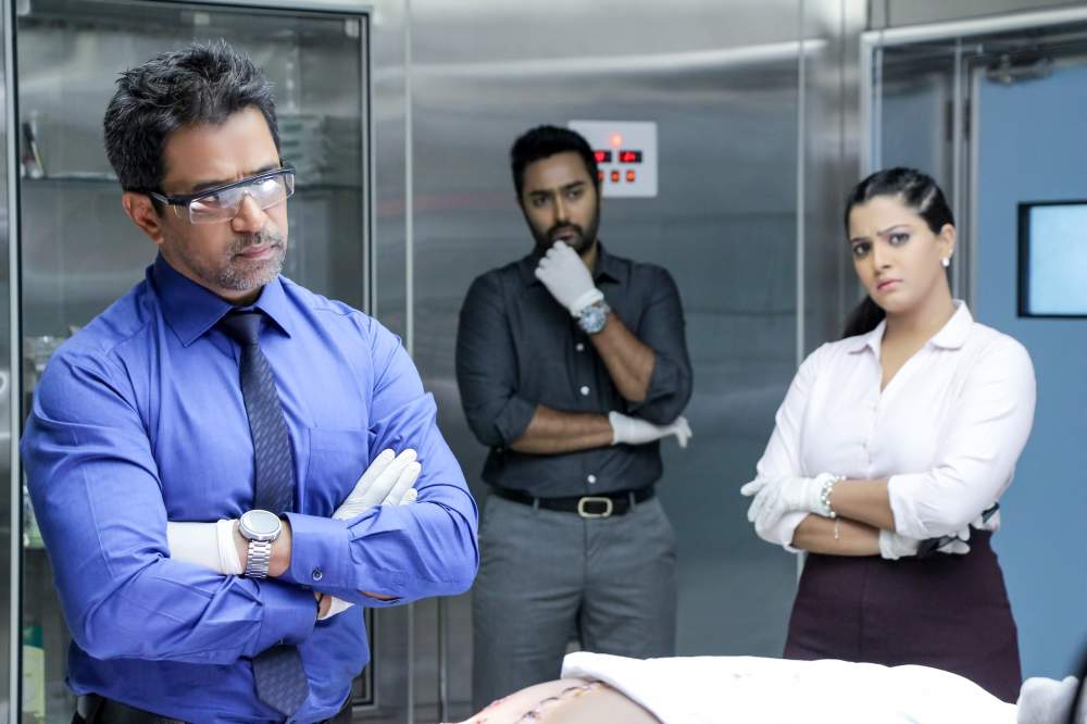 Arjun, Varalaxmi Sarathkumar, Prasanna stills from Nibunan Movie