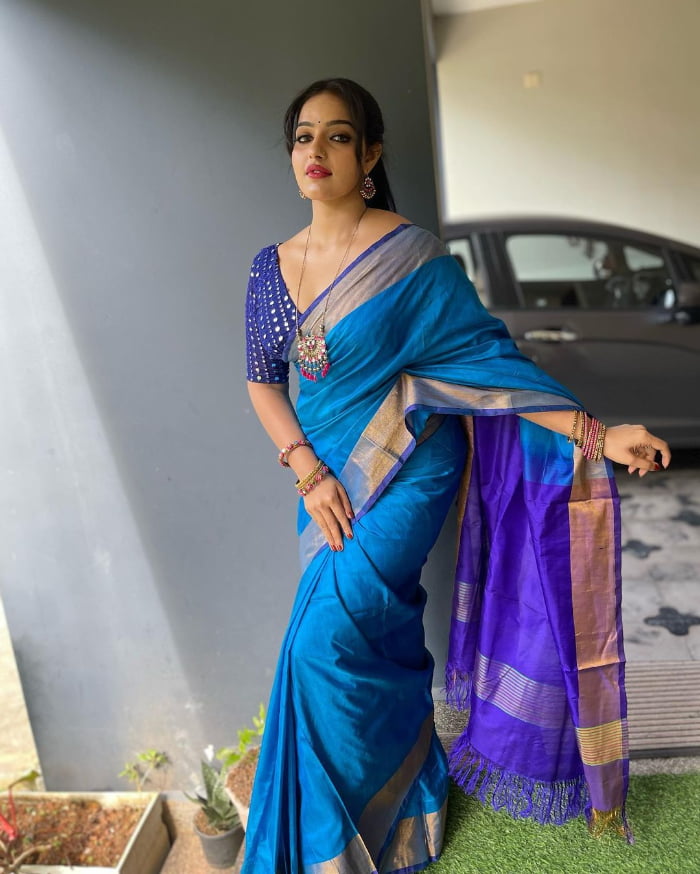 \"Explore the mesmerizing world of Malavika Menon through these stunning images. Get ready to be enchanted by her beauty and charm. Don't miss out on the latest trending sensation. #MalavikaMenon #SizzlingImages #BeautyUnleashed\"