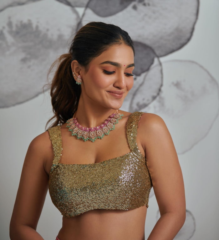 \"Explore the enchanting world of Saniya Iyappan through these mesmerizing stills. Witness the latest trending beauty and elegance with this collection. #SaniyaIyappan #TrendingStills #ElegantPortraits\"