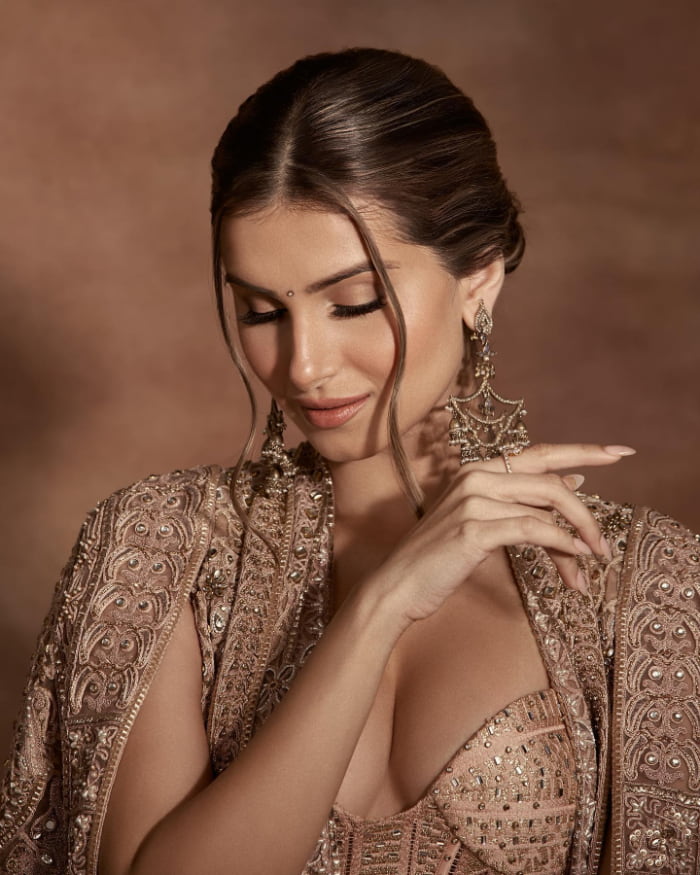 \"Discover the enchanting beauty of Bollywood sensation Tara Sutaria in these stunning photographs. Dive into the latest trend in glamour with Tara's charming stills. Don't miss out on this mesmerizing visual journey!  #TaraSutaria #BollywoodGlamour #CharmingStills #TrendingPhotographs\"