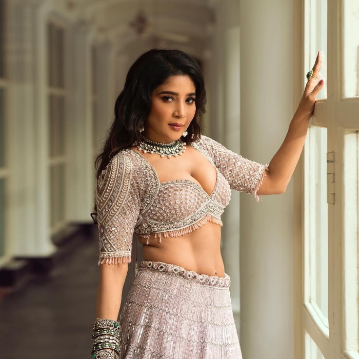 \"Discover the allure of Sakshi Agarwal through these mesmerizing stills capturing her charm. Dive into the latest trending snapshots showcasing Sakshi Agarwal's elegance and beauty. Explore glamour photography at its finest with this collection! #CelebrityGlamour #FashionShoot #TrendingBeauty\"