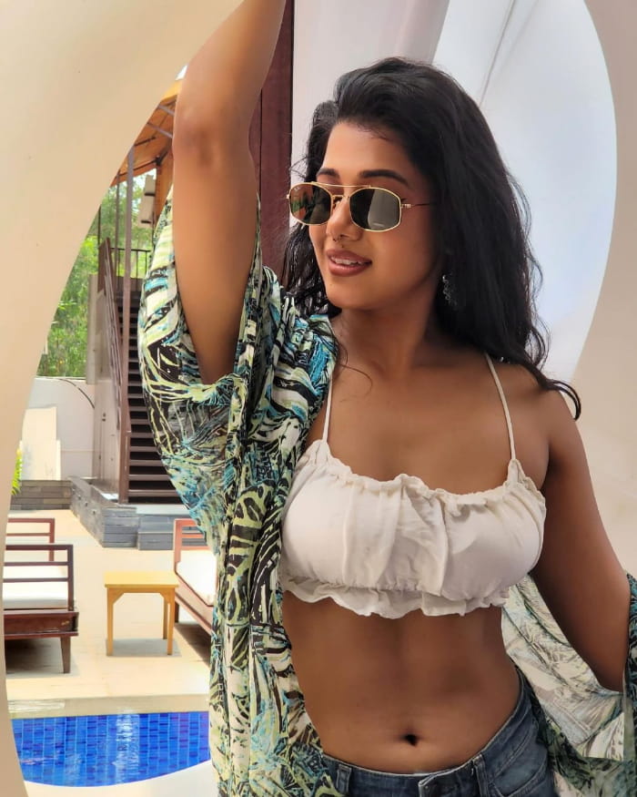 Explore mesmerizing stills of Shilpa Manjunath, showcasing her beauty and charm. Get lost in her captivating gaze and elegant poses. #ShilpaManjunath #PhotoCollection #StunningStills